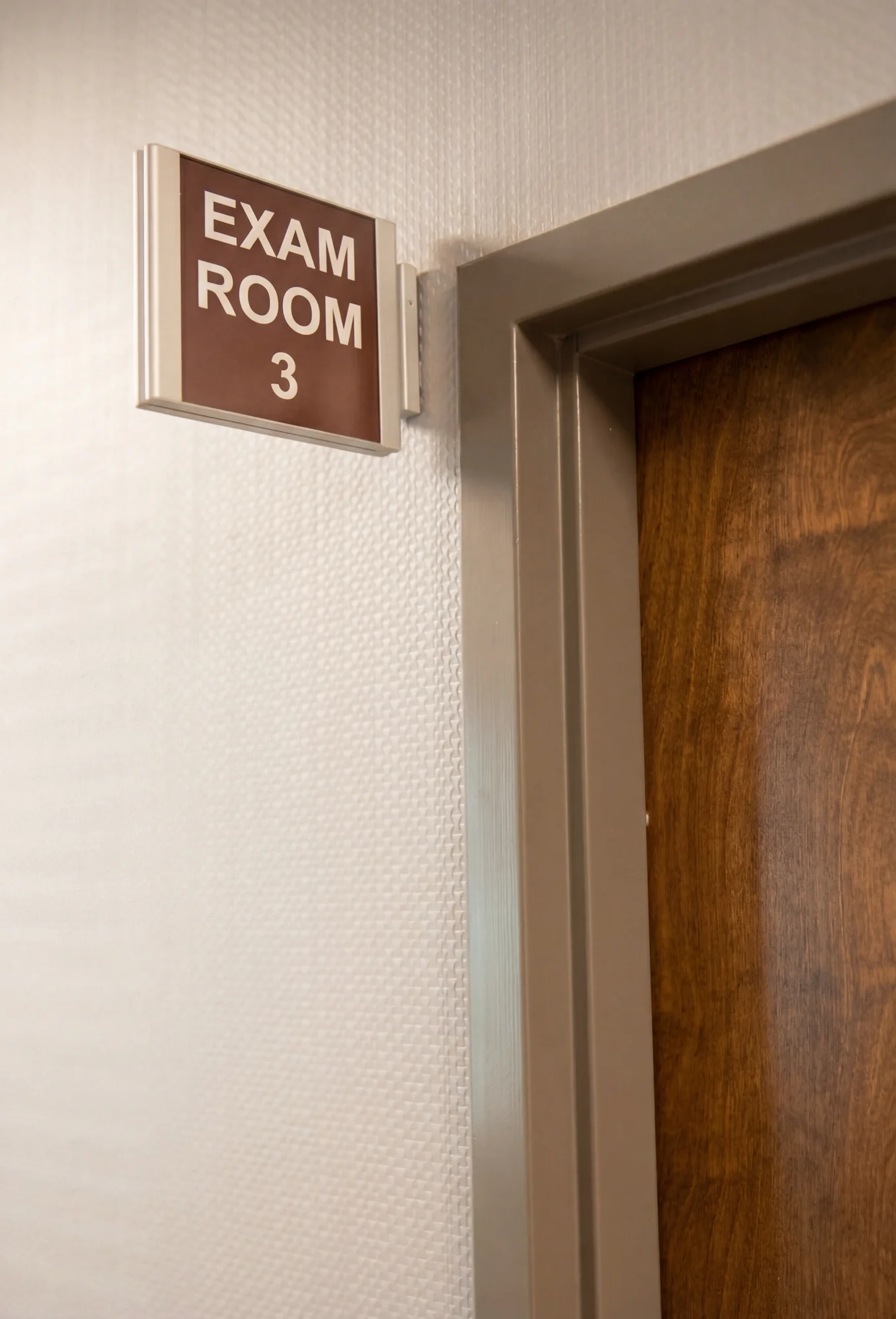 Corridor sign bracket